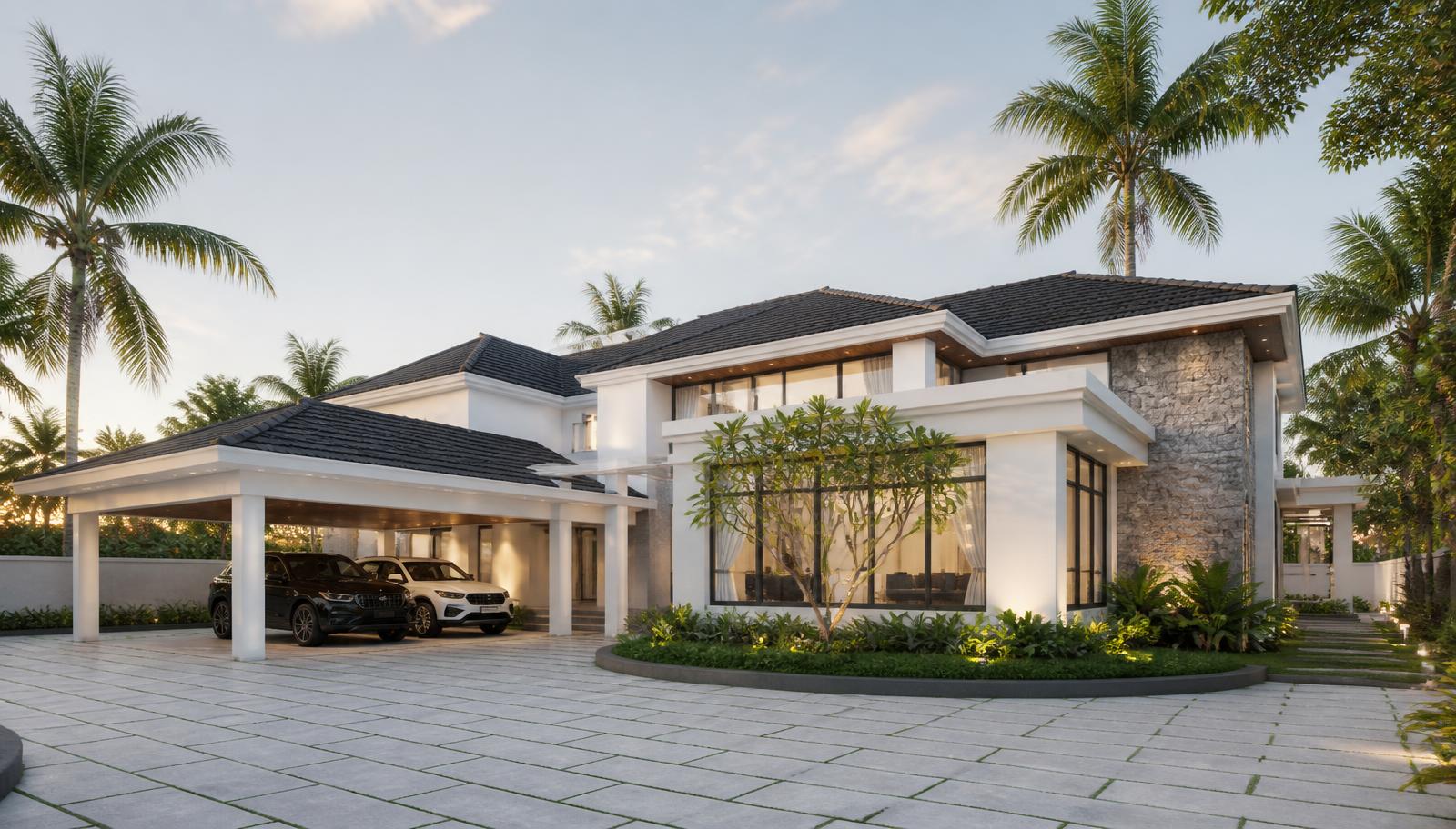Luxury white villa at dusk with charcoal tiled roofs, stone feature wall, covered carport and a wide paved forecourt